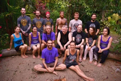 Group photo of fifteen people in a tropical setting at the International Nath Order mela 2016.