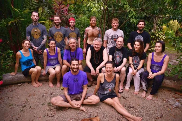 Group photo of fifteen people in a tropical setting at the International Nath Order mela 2016.